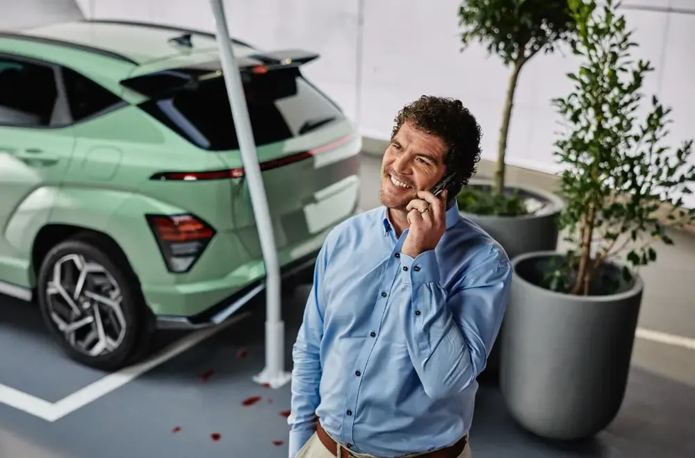 Male smiling while speaking on his cellphone
