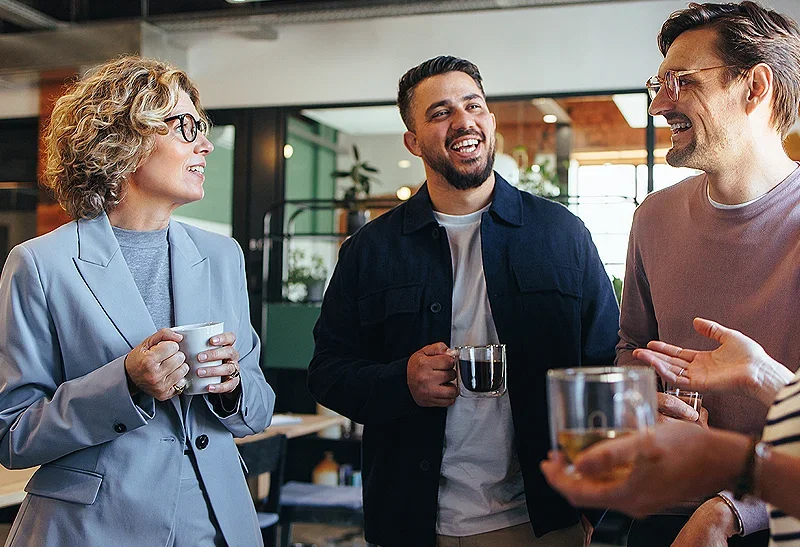Some business people having coffee in office - Business Insurance - Homepage